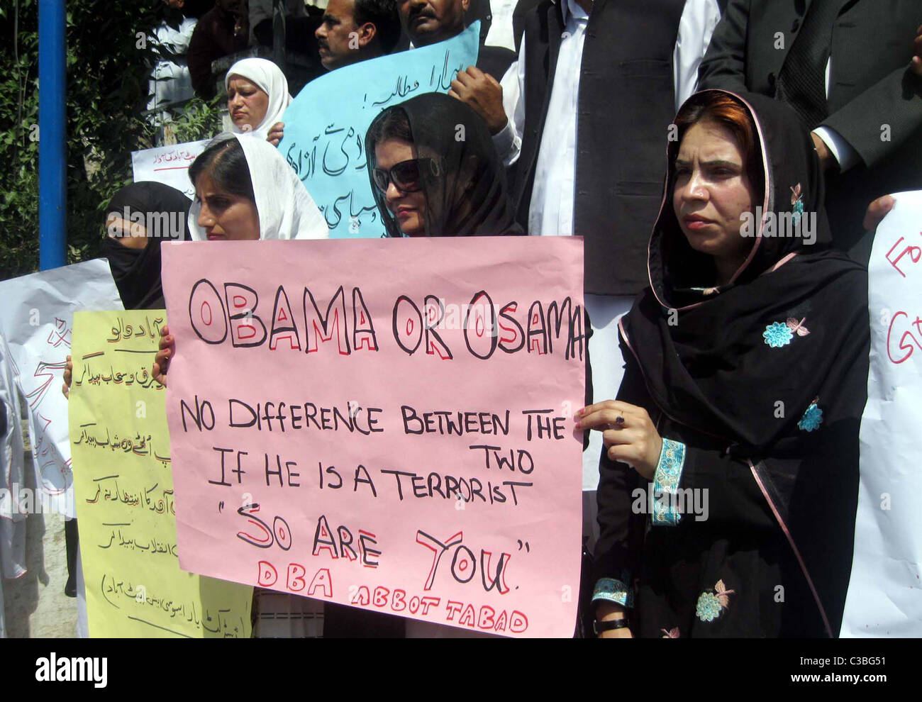 Supporters of District Bar Association hold posters during protest ...