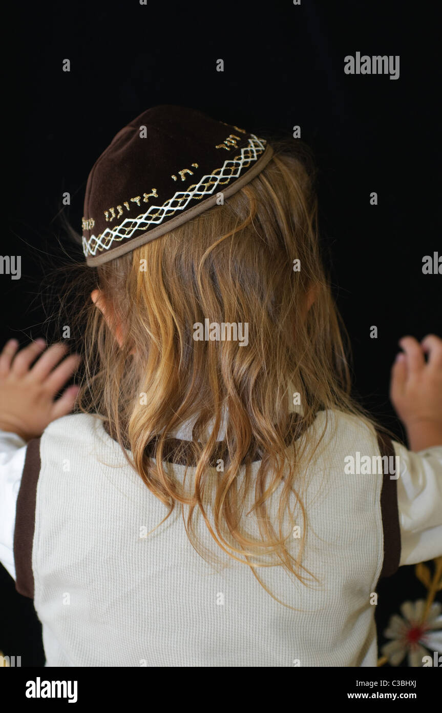 Shalev, Young Jewish boy of three having his first ritual haircut called Upsherin (Yiddish: lit. 'shear off') or Chalaka. Stock Photo