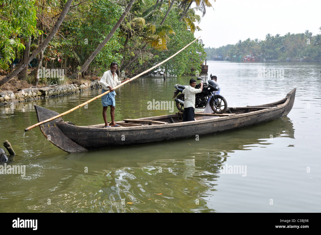 India, Kerala backwaters, primitive transport boats Stock Photo Alamy