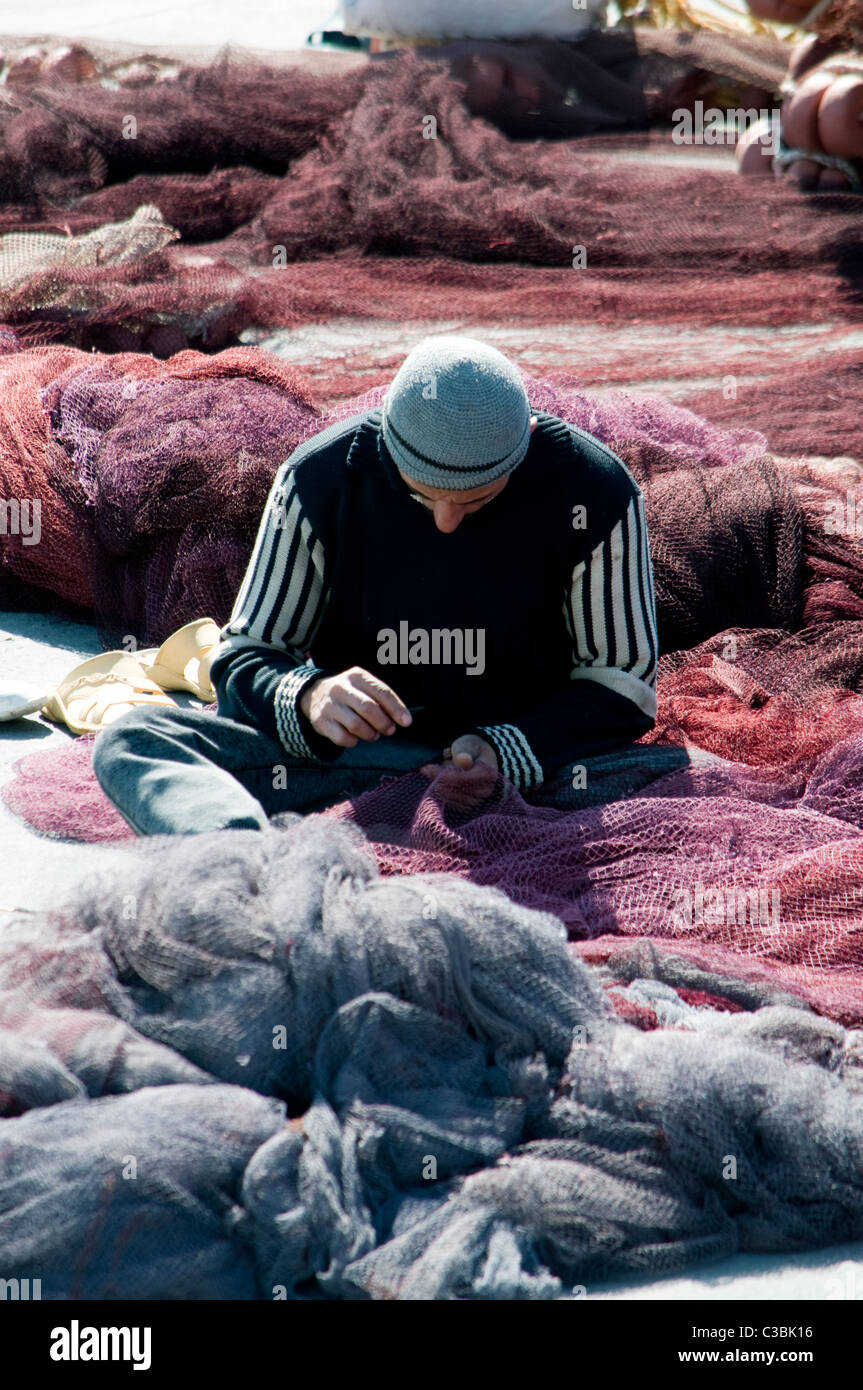 Fisherman at work in Hurghada harbour Stock Photo