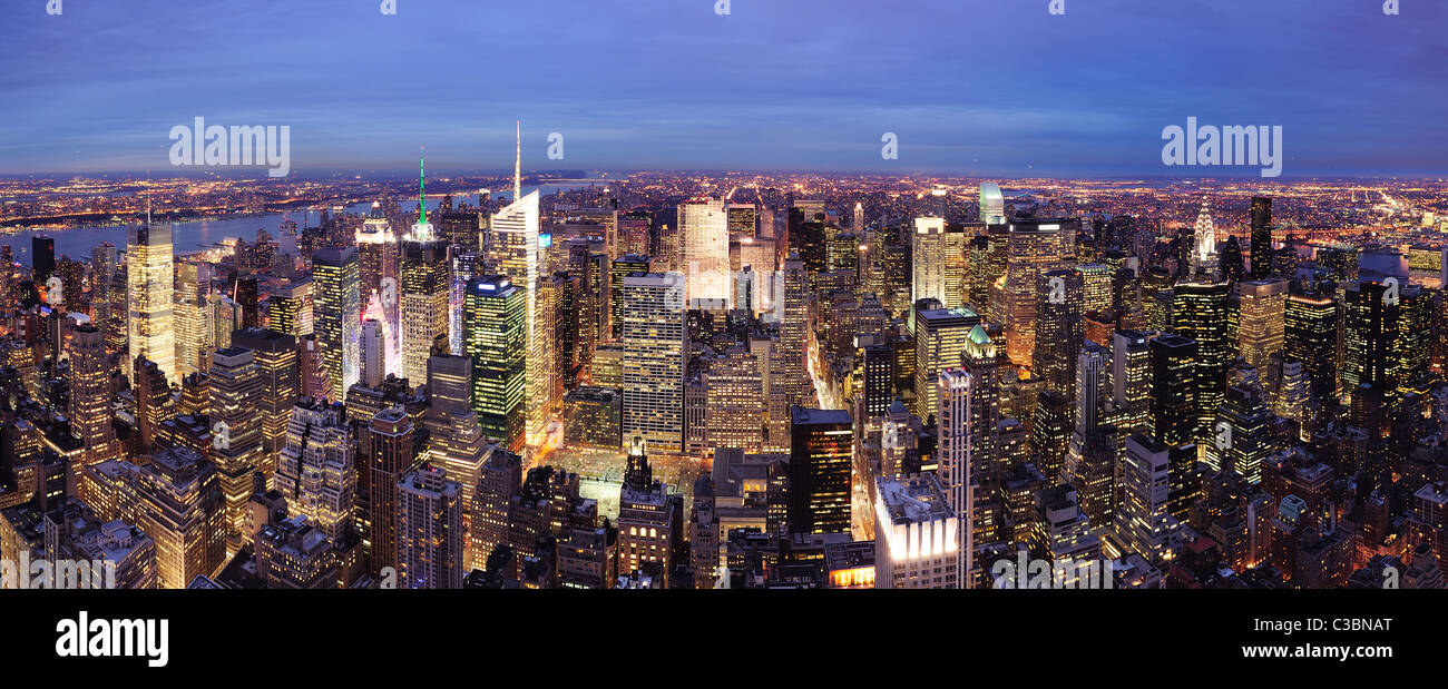 New York City Manhattan Times Square night city skyline aerial view with urban skyscraper illuminated. Stock Photo
