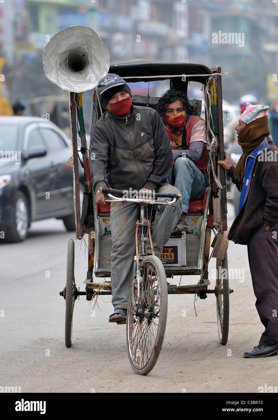 A rickshaw, with a loud Hailer going through town, Nepal. Stock Photo