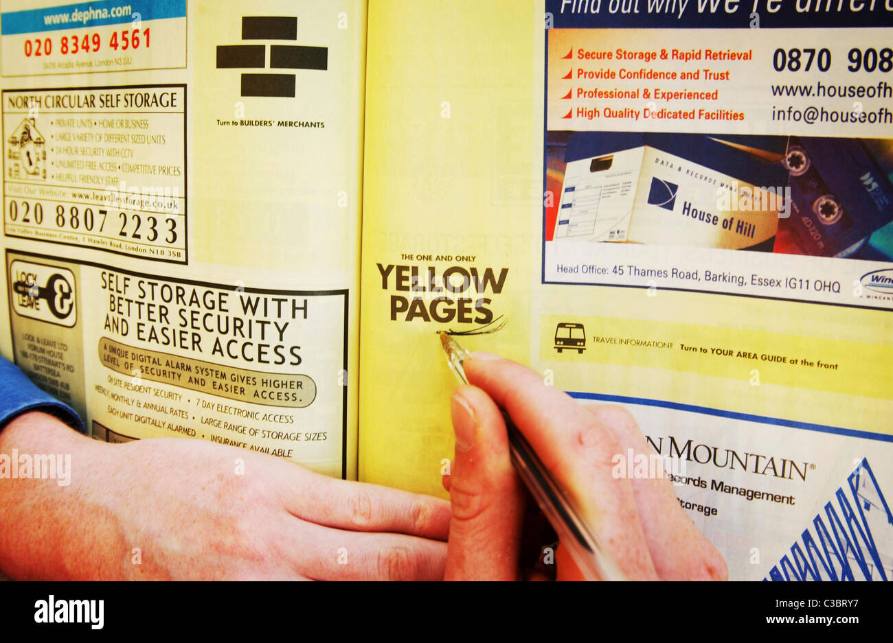 A man using the Yellow Pages telephone Directory Stock Photo Alamy