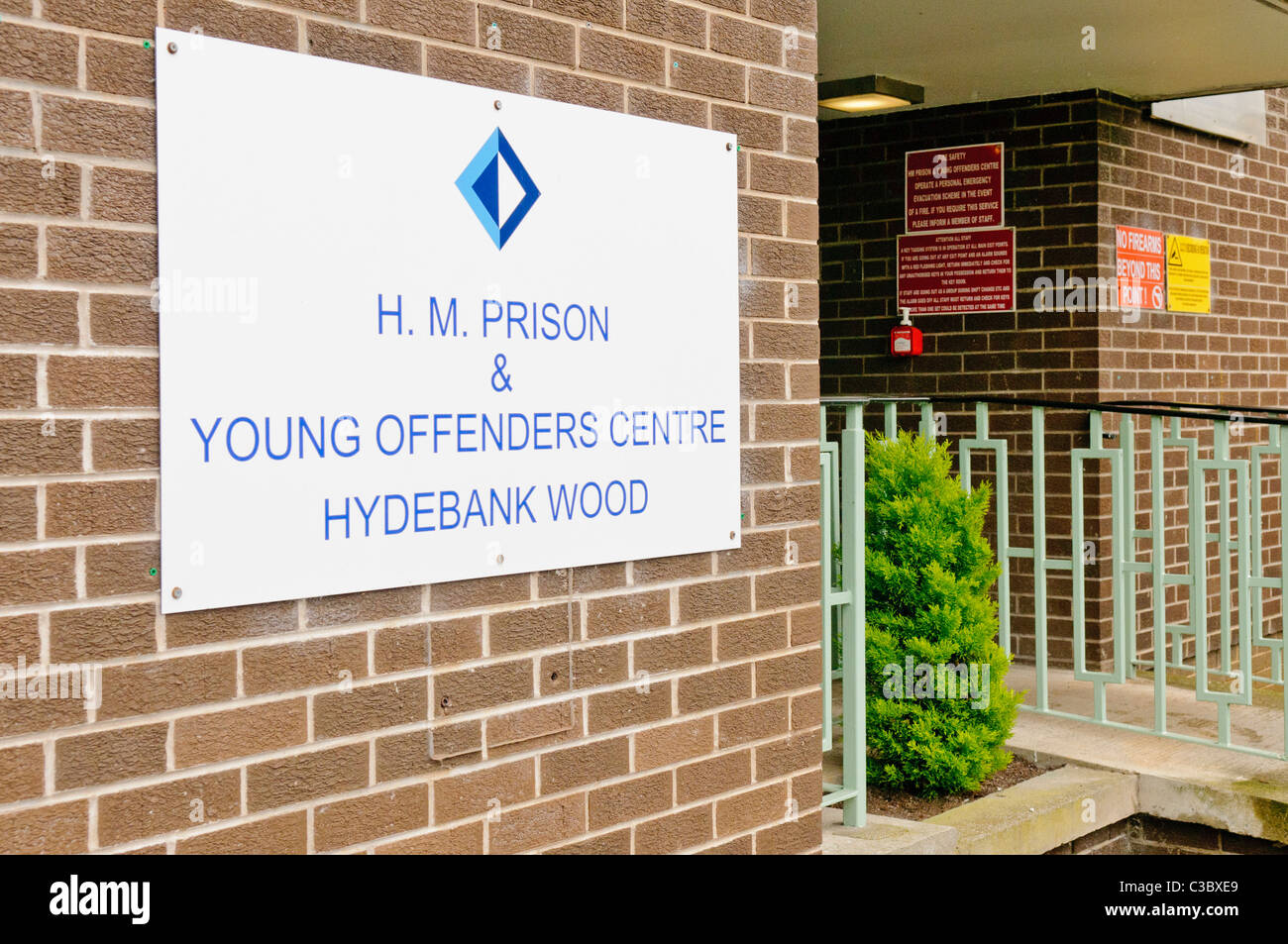 Sign outside entrance to Hydebank Wood Young Offender's Centre, Belfast Stock Photo