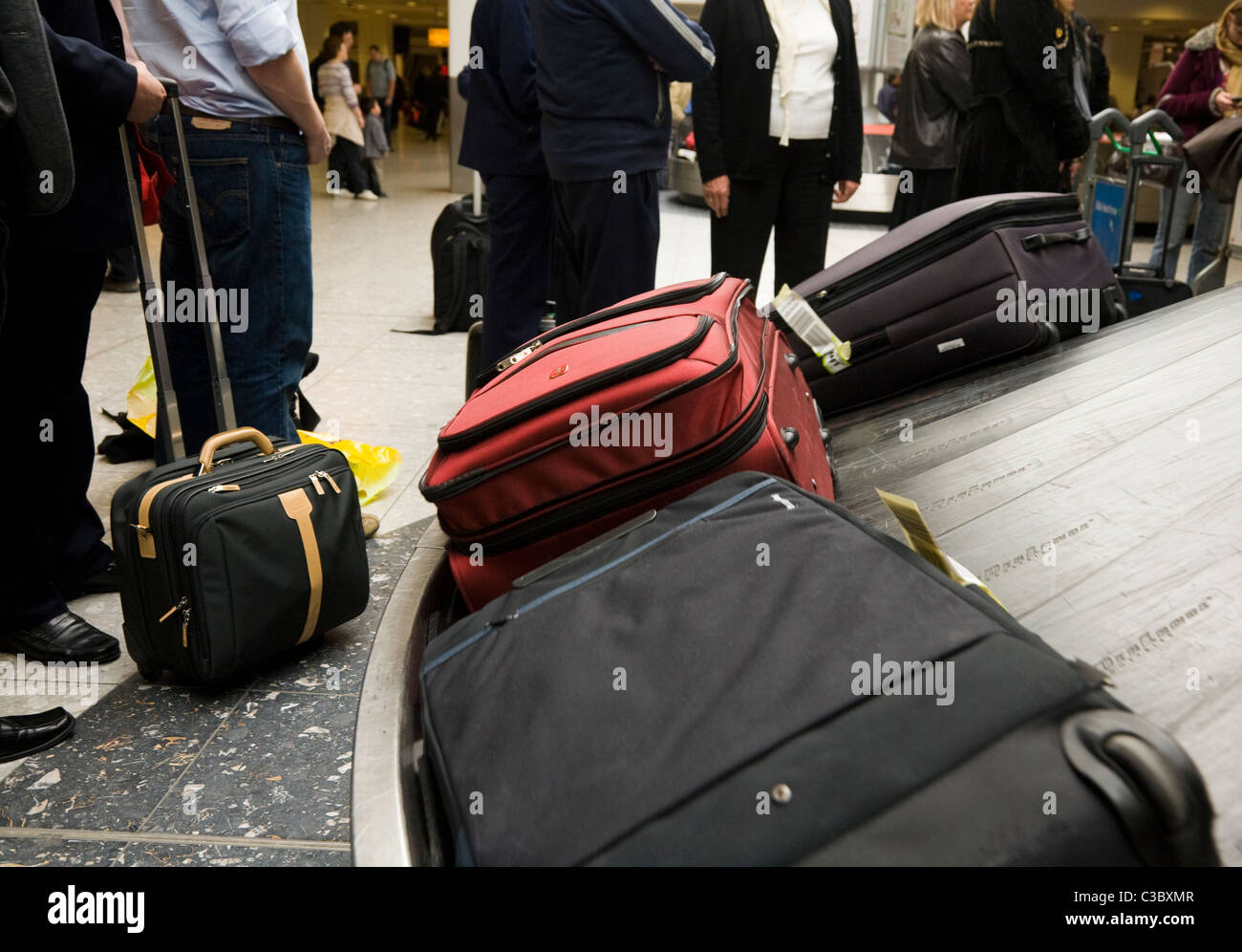 Suitcase on the luggage baggage reclaim carousel belt at London
