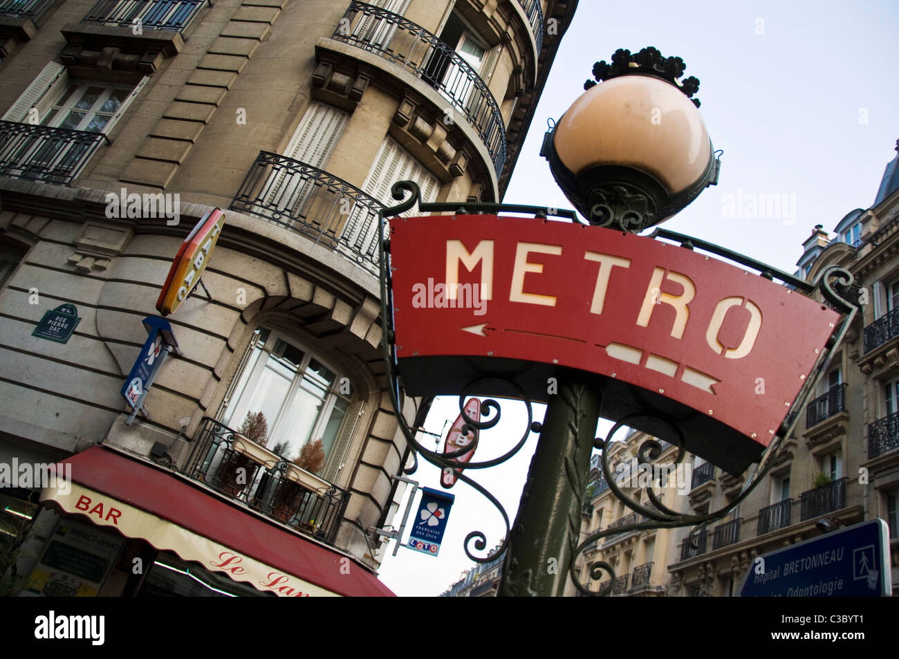 Metro sign and cafe tabac in Rue Pierre Dac 18e Montmartre Paris France Stock Photo