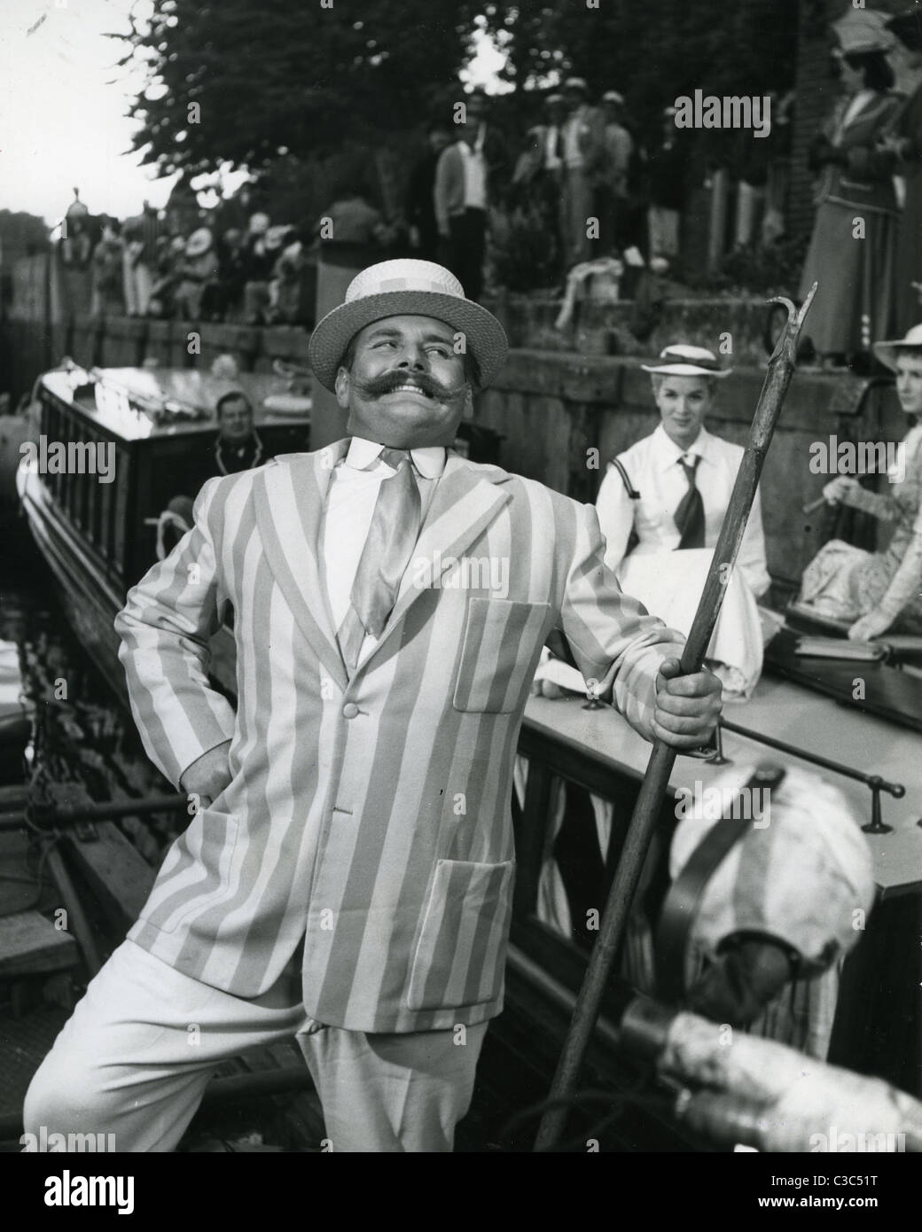 JIMMY EDWARDS (1920-1988) English comic writer and actor at Bray lock in the 1956 film Three Men In A Boat. Shirley Eaton behind Stock Photo