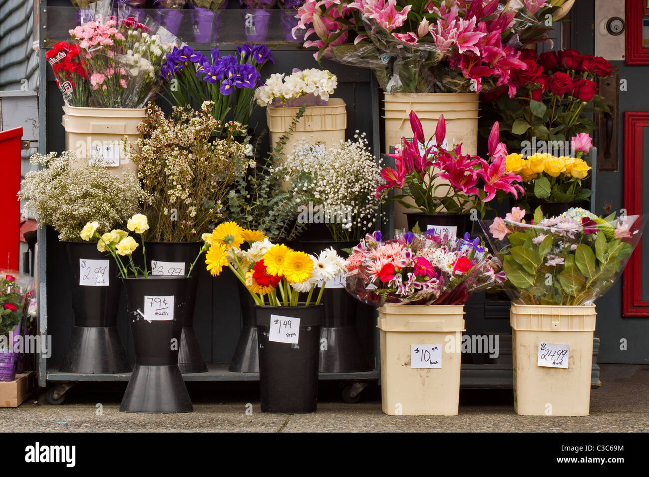 Flower bouquets for sale outside of small general store-Victoria, British Columbia, Canada. Stock Photo