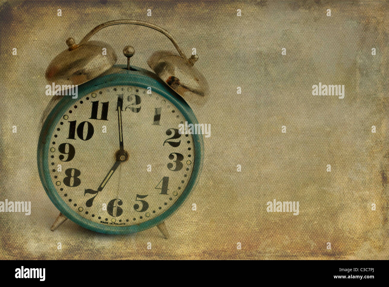 old alarm clock on vintage background Stock Photo