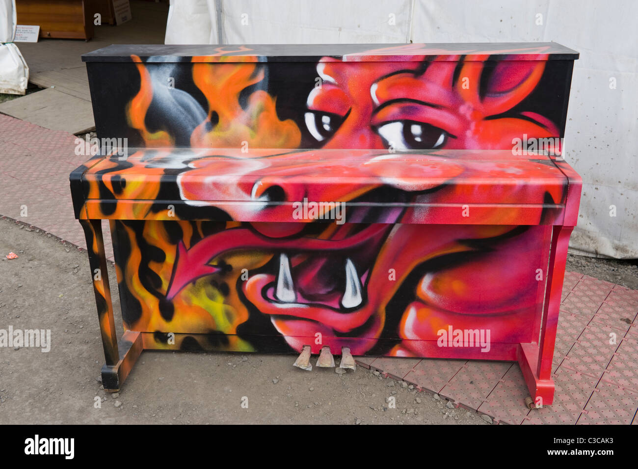 Red Dragon painted on piano at National Eisteddfod 2010 Ebbw Vale Blaenau Gwent South Wales UK Stock Photo