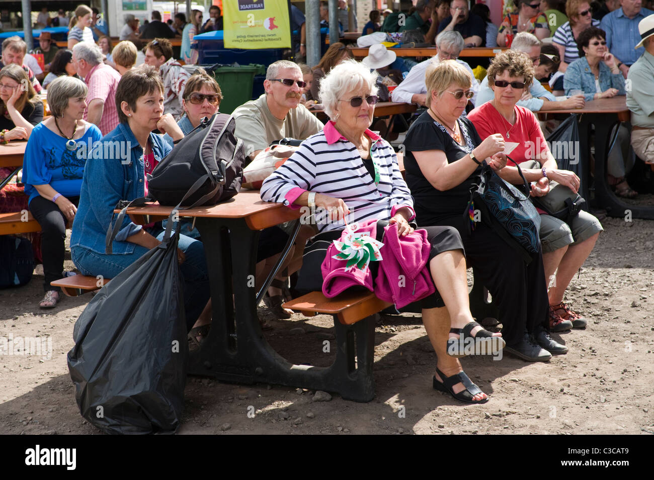 People sat on benches relaxing at National Eisteddfod 2010 Ebbw Vale Blaenau Gwent South Wales UK Stock Photo