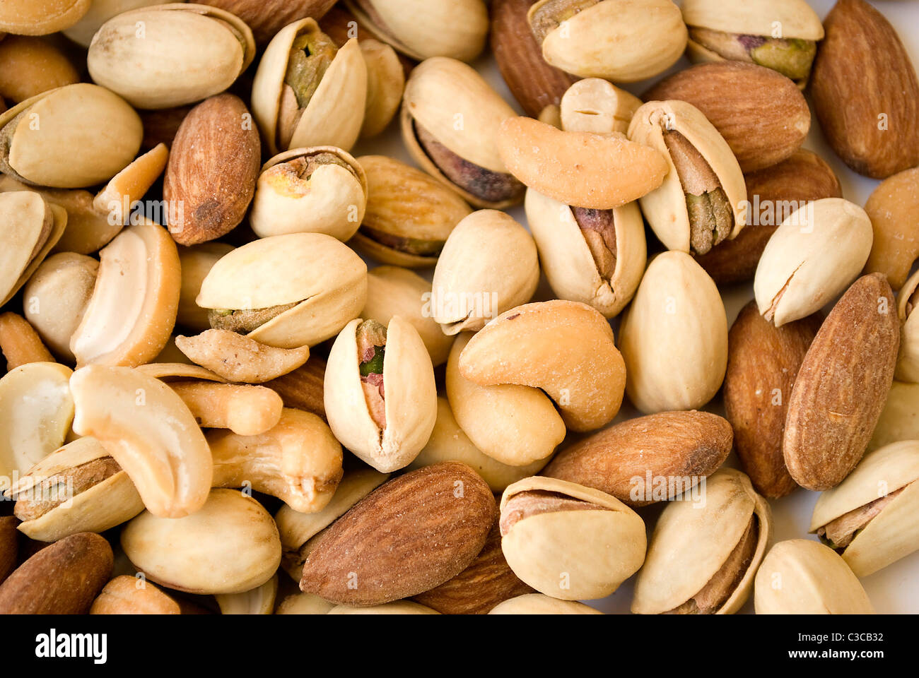 pile of almond pistachios and cashew nuts roasted Stock Photo Alamy