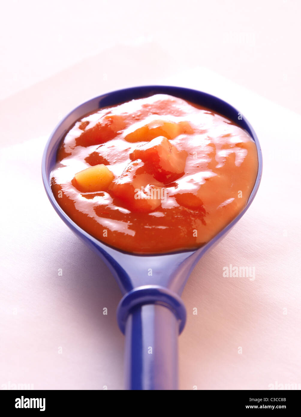 Salsa in a spoon Stock Photo