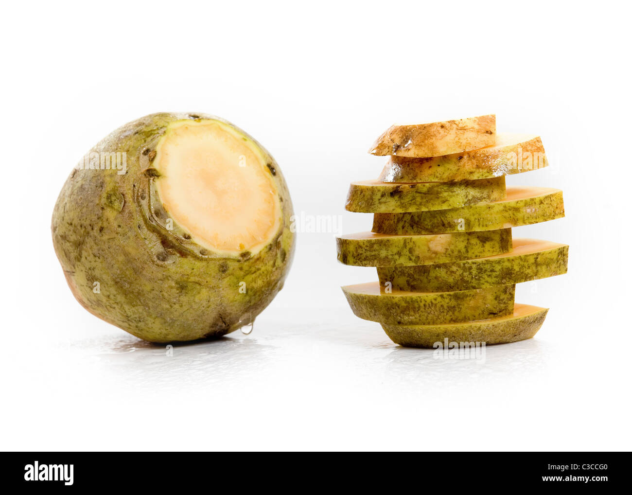 Yellow Turnip and some freshly cut slices of it Stock Photo