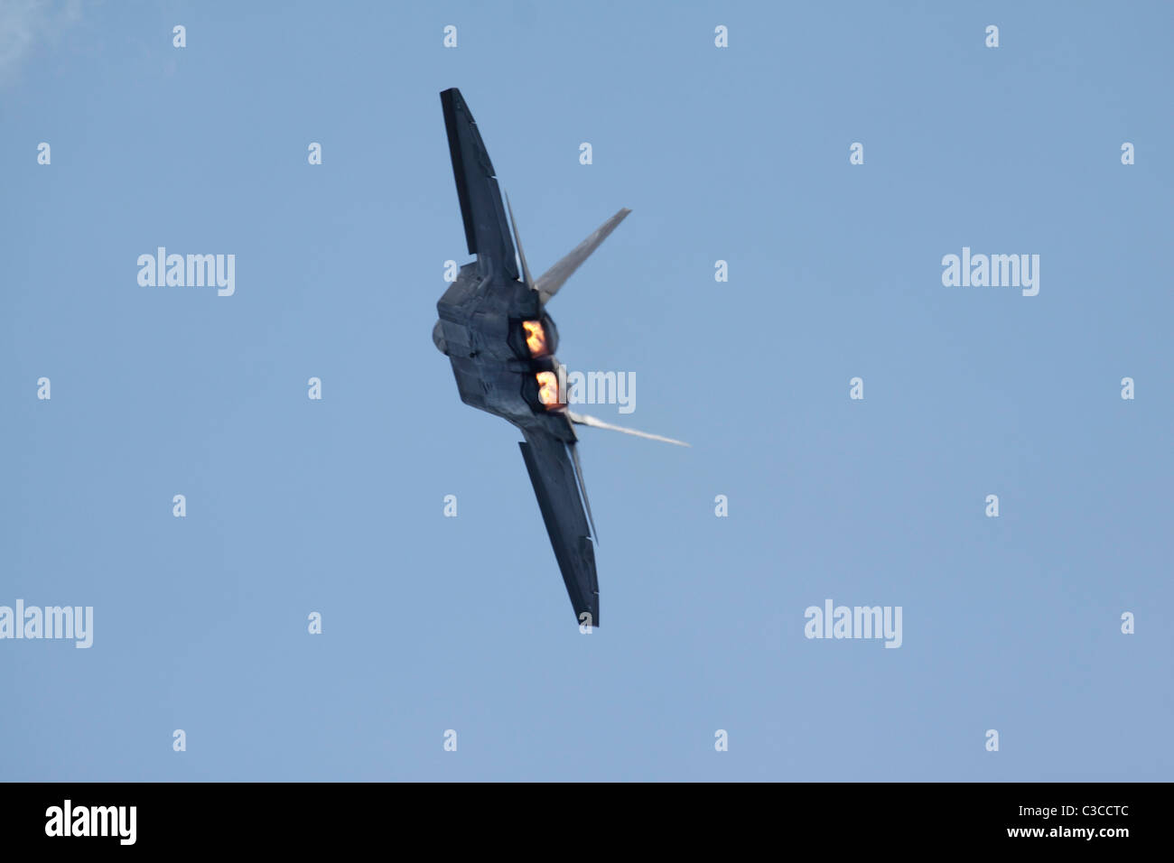 An F-22 flies in afterburner. Stock Photo