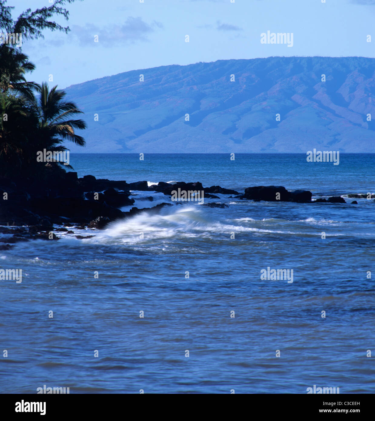 Bright daylight view of Kahana, Maui coastline with Molokai island in