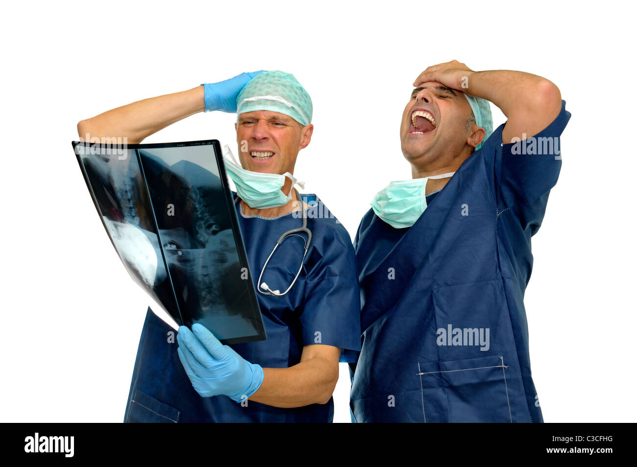 Doctors looking at an X-ray isolated in white Stock Photo - Alamy