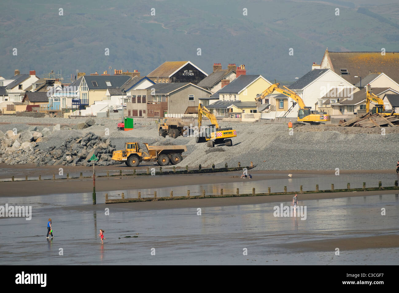Contractors strengthening the sea defences at Borth on the Cardigan Bay coast of west Wales UK Stock Photo