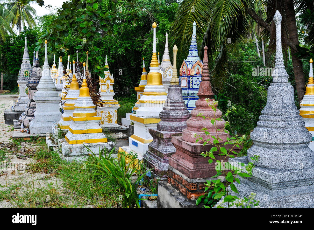 Many ornately shaped shrine stones, made out of everything from stone to tile and decorated with paint, metal or tiles. Stock Photo