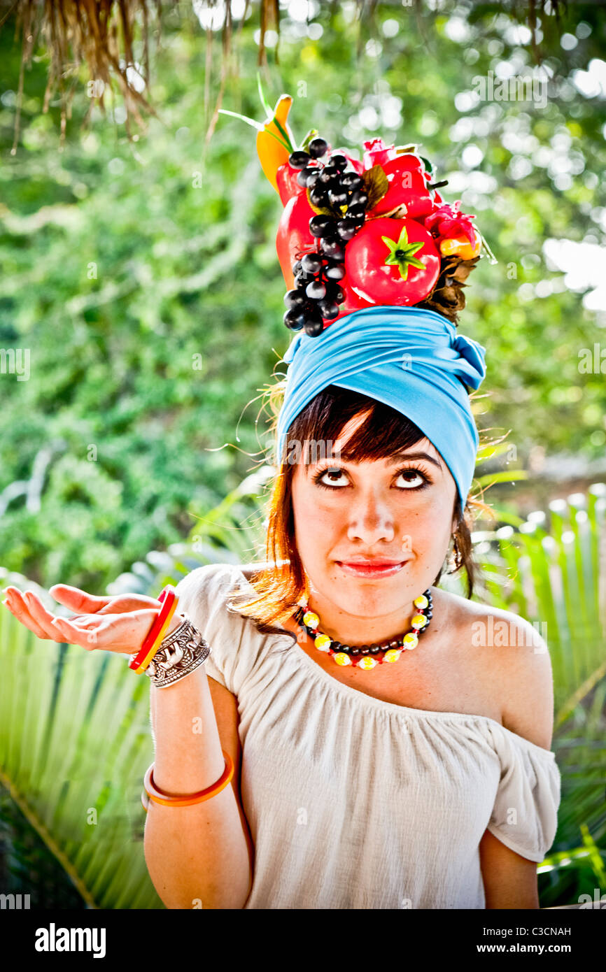 young woman wearing fruit hat Stock Photo Alamy
