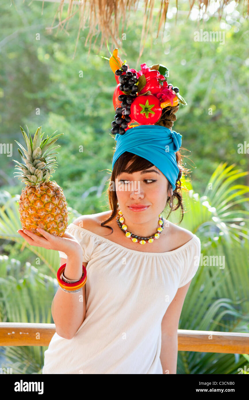 young woman wearing fruit hat Stock Photo Alamy
