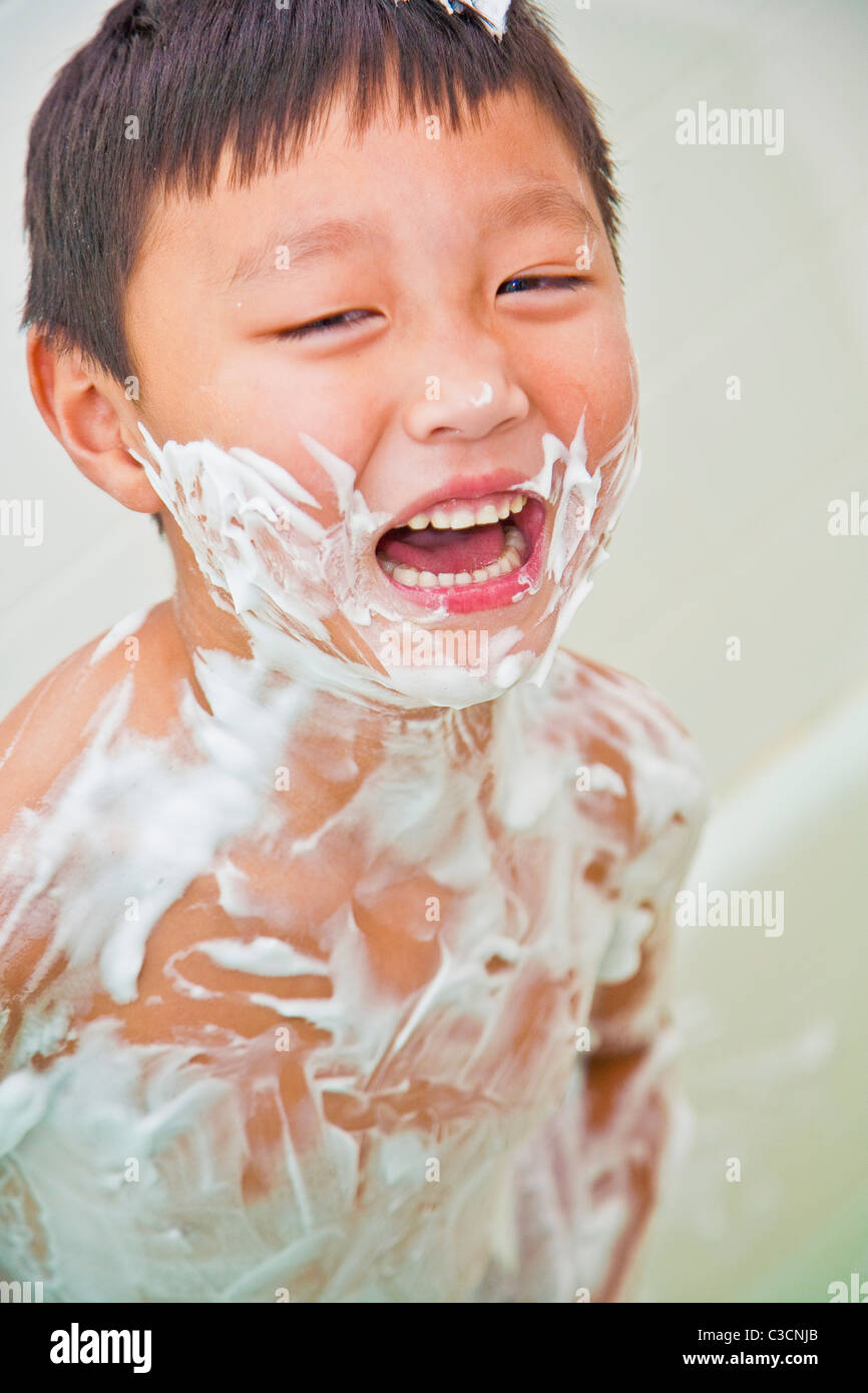 boy covered in shaving cream Stock Photo Alamy