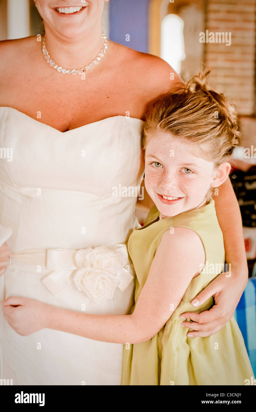 bride hugging young girl Stock Photo