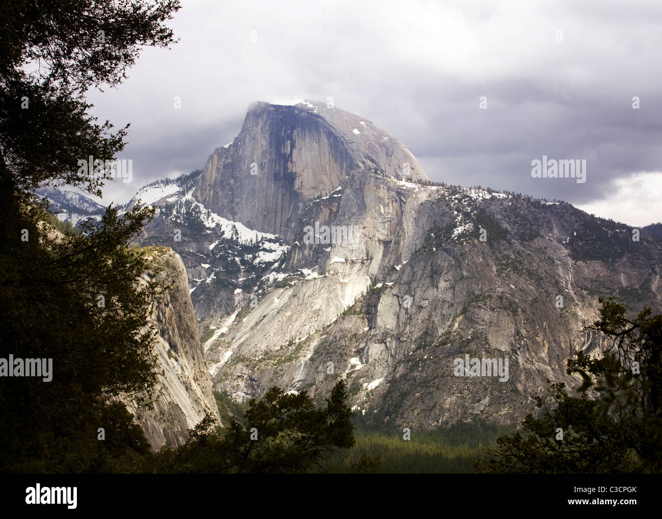 Yosemite's Half Dome under cloudy sky Stock Photo