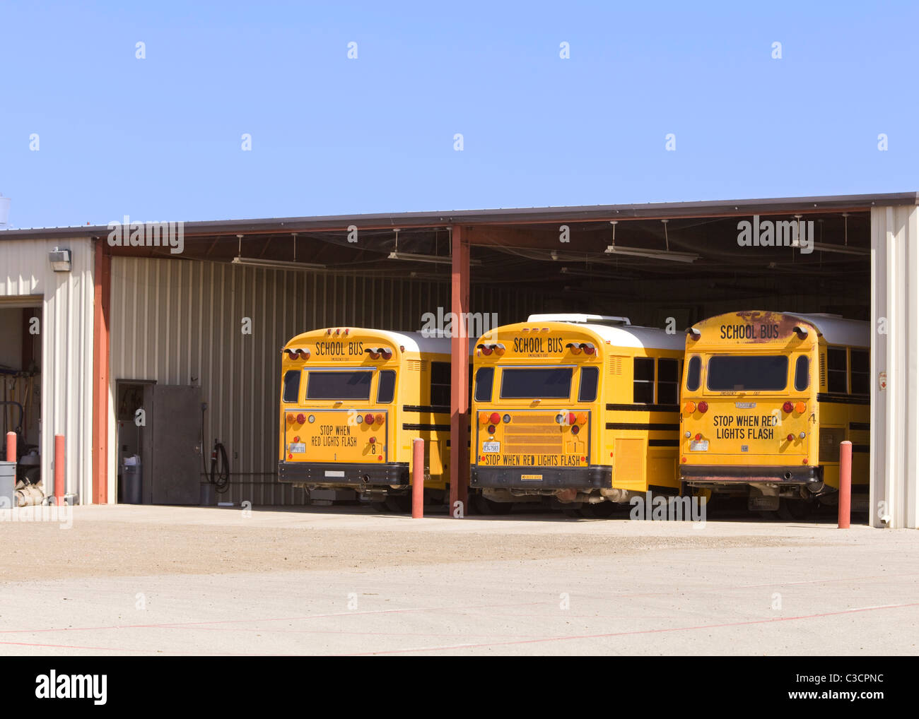 School buses in garage USA Stock Photo Alamy