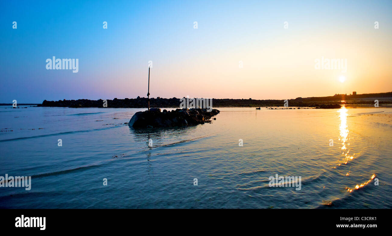 guernsey channel islands dawn sunrise beach Stock Photo
