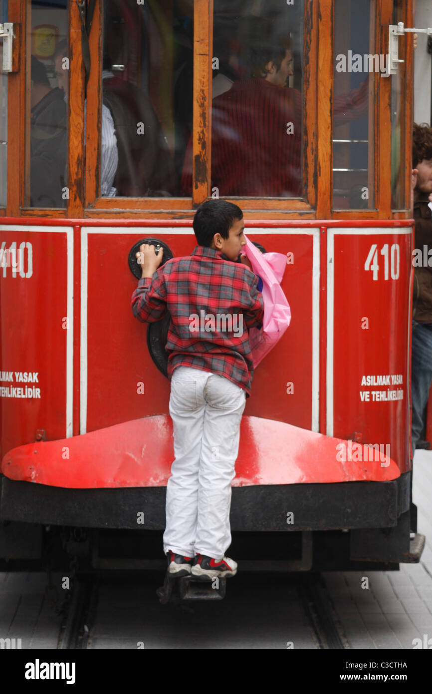 A boy on taksim Tramway of Istiklal Street, Istanbul. Stock Photo