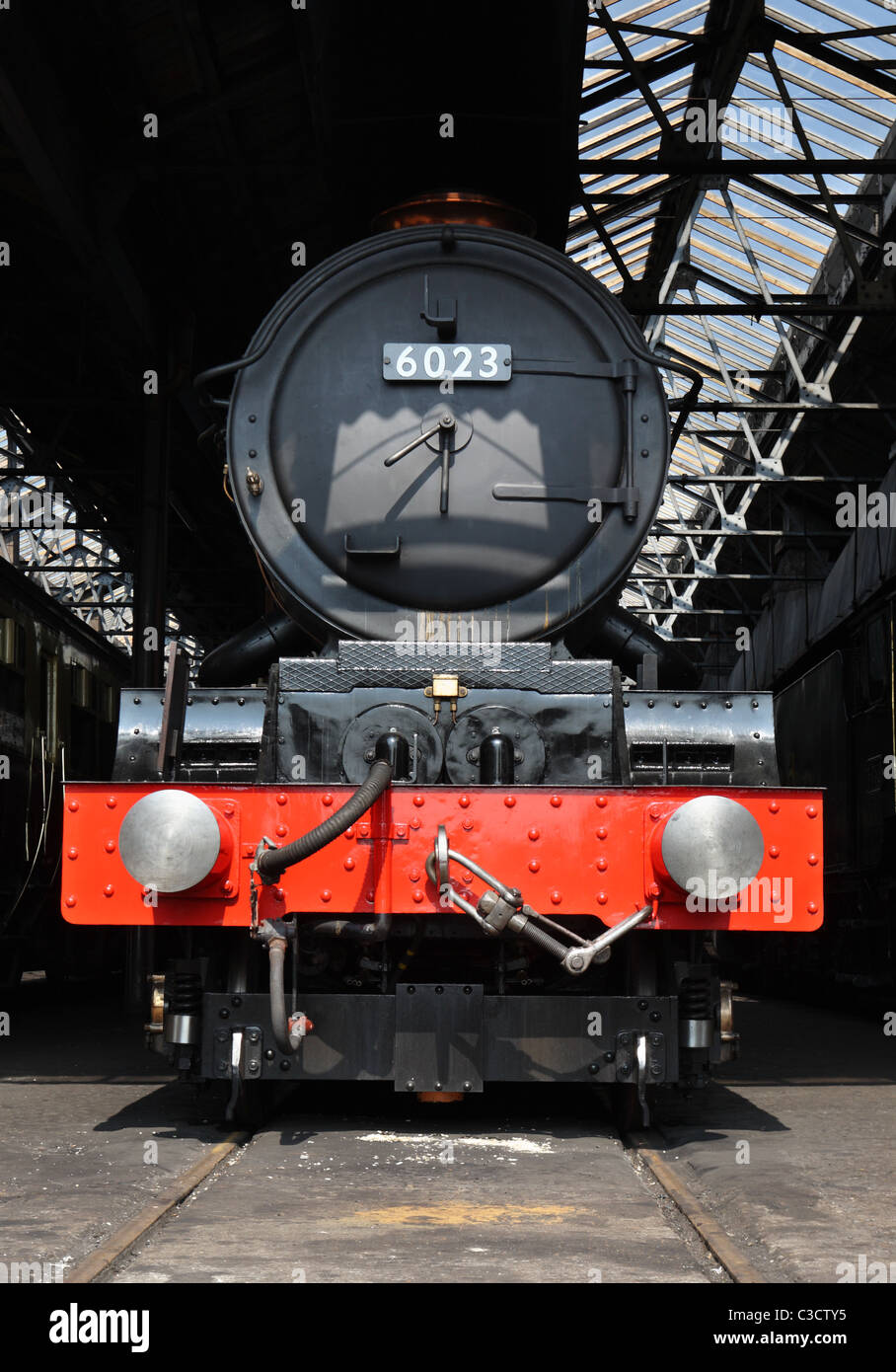 Front view of former GWR steam locomotive 6023 King Edward 11, seen at Didcot Railway Centre loco shed. Stock Photo