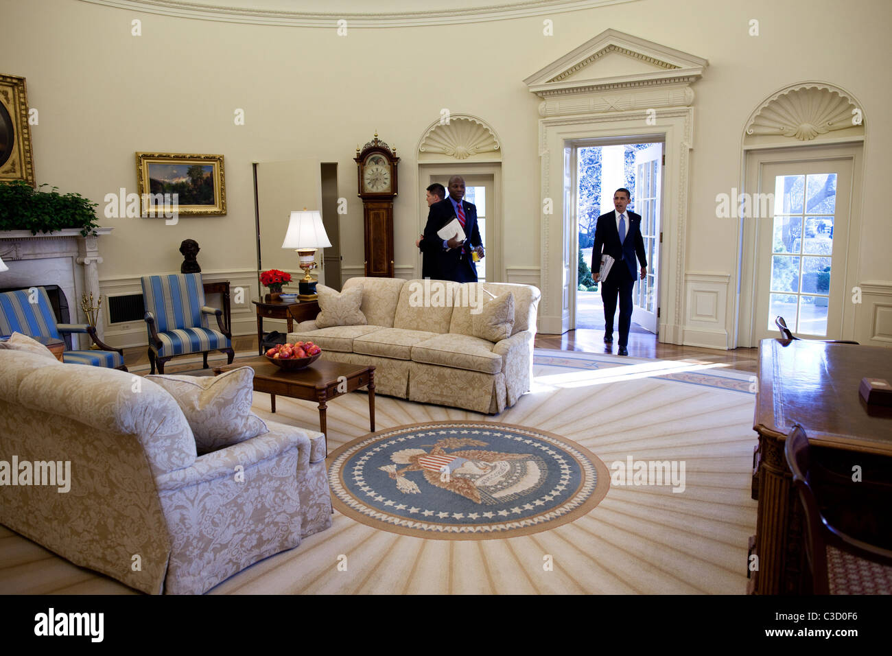 US President Barack Obama walks into the Oval Office at the White House ...
