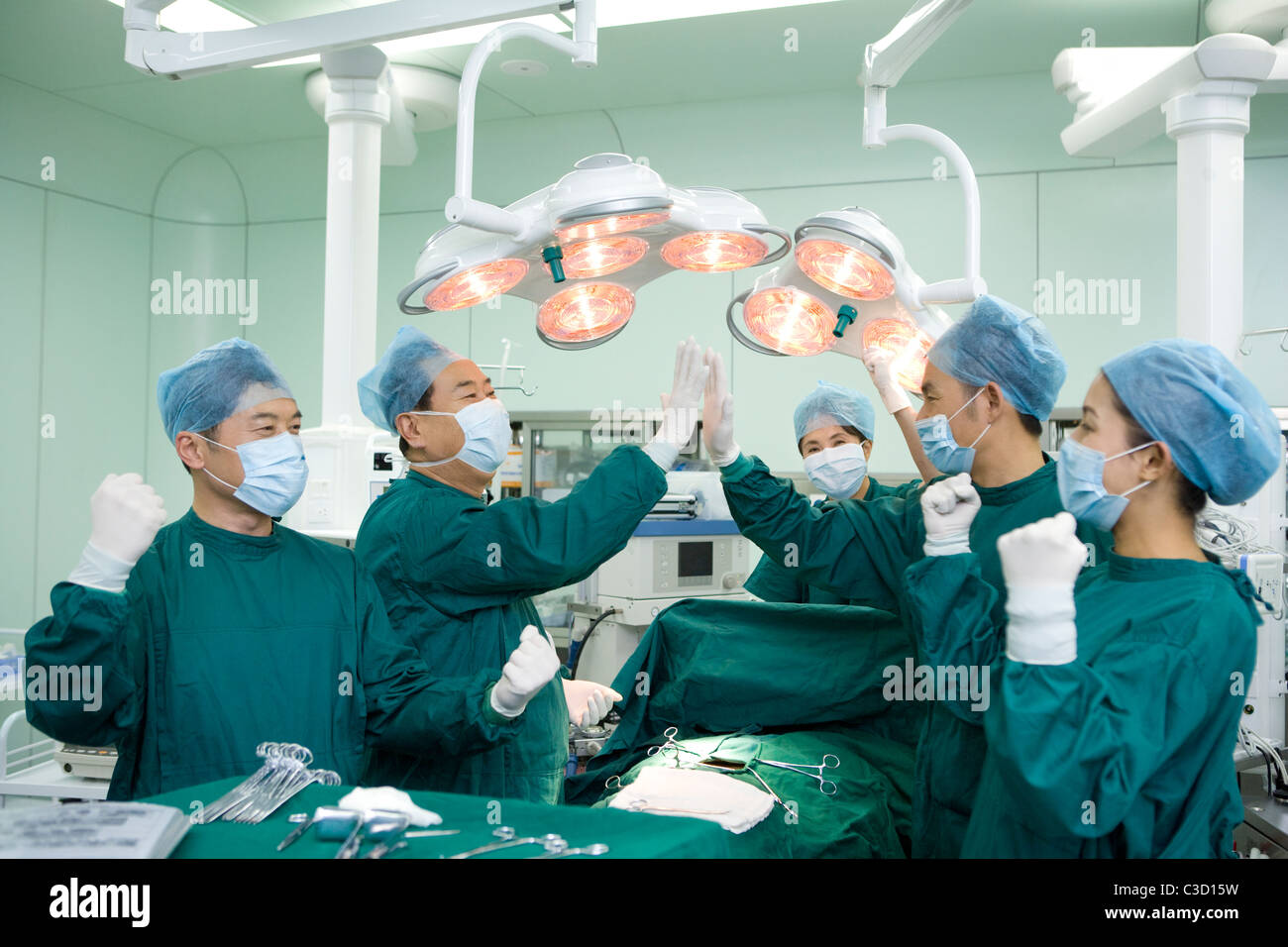 team-of-surgeons-celebrating-success-C3D