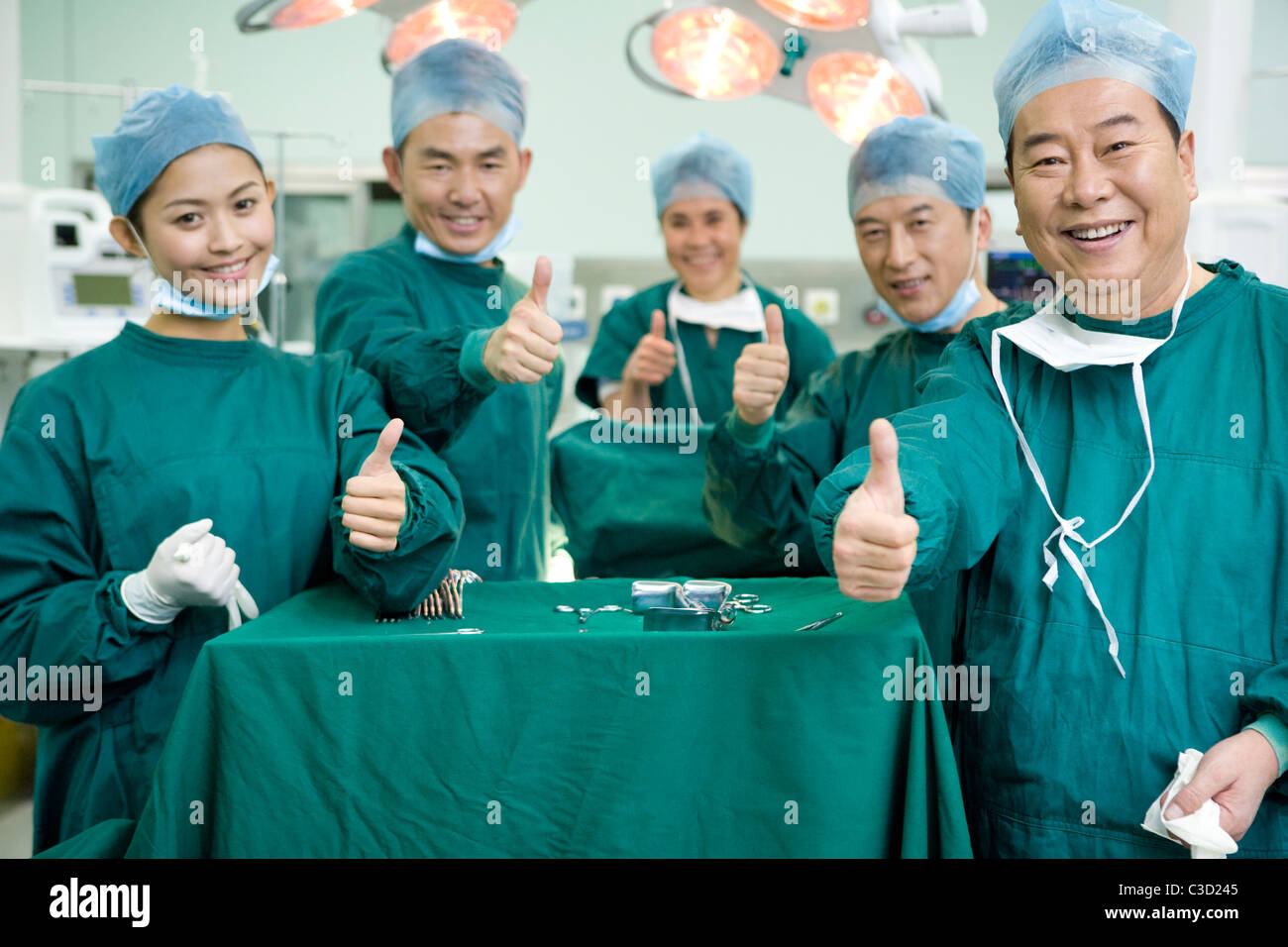 Group happy doctors thumbs hi-res stock photography and images - Alamy