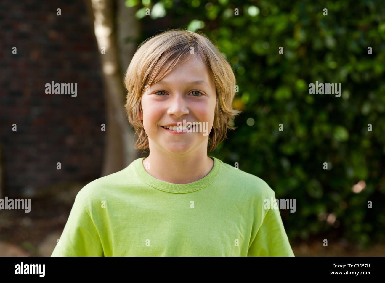 Little boy looking at the camera in the garden Stock Photo - Alamy