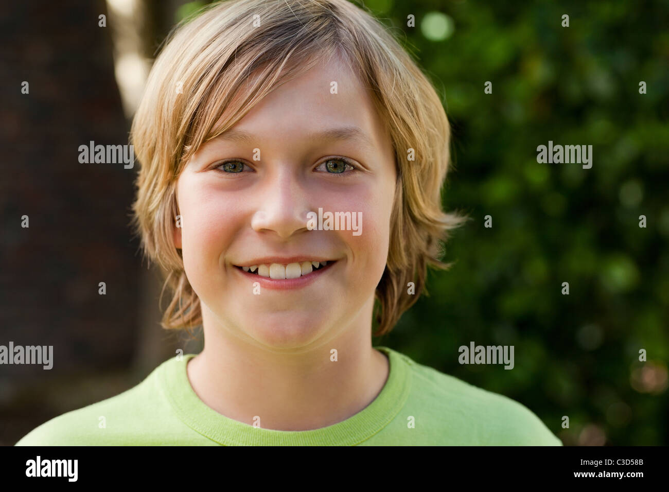 Little boy looking at the camera in the garden Stock Photo - Alamy