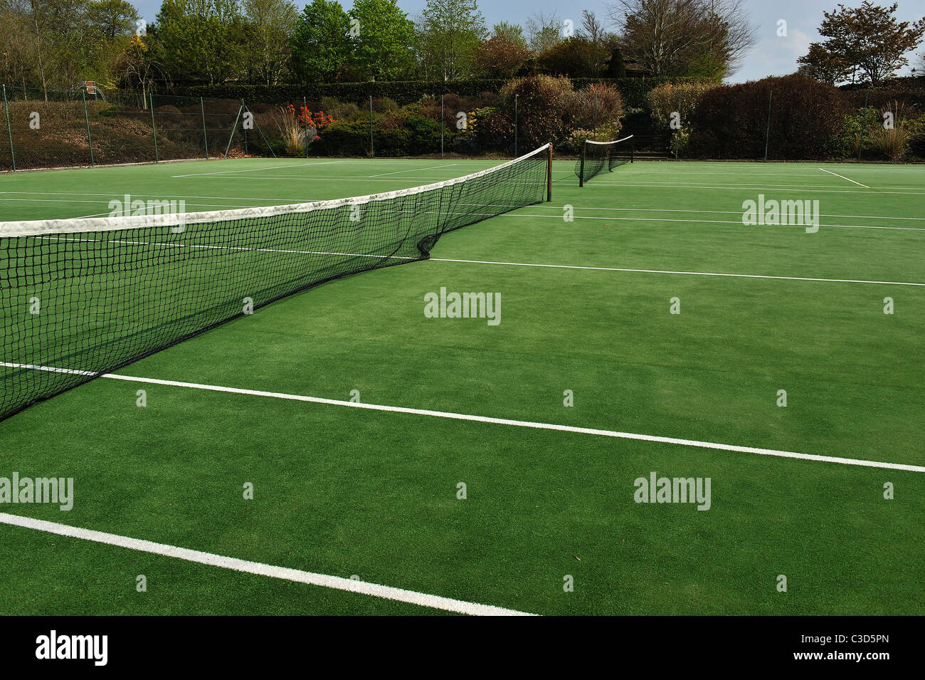 Green tennis court, ready for the next game Stock Photo