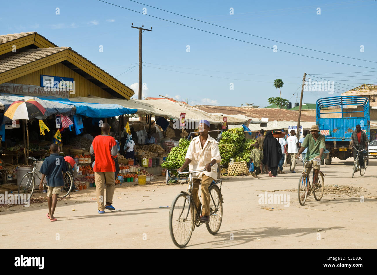 Man on a bicycle in the busy market area of Dodoma Tanzania Stock Photo