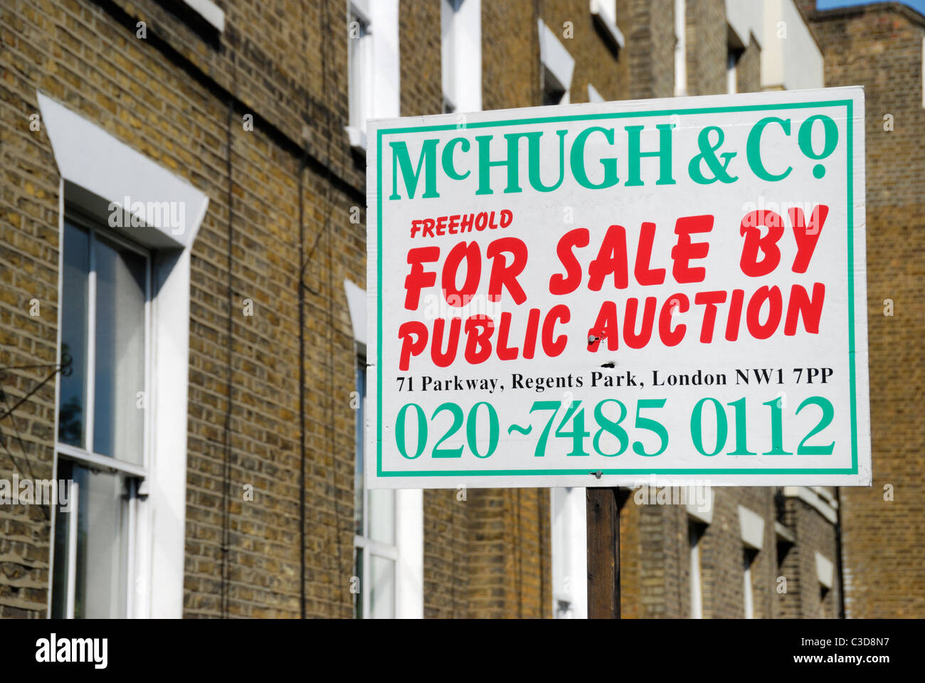 For Sale by Public Auction sign outside a house Stock Photo