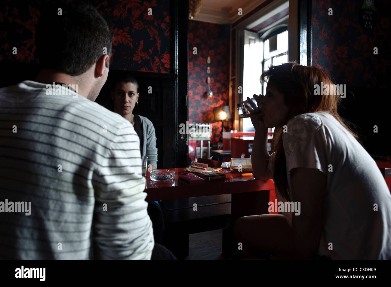 Young people drinking in bar Stock Photo