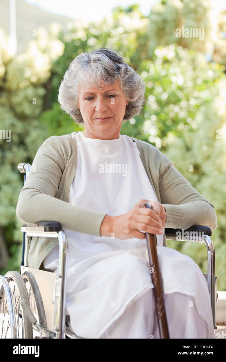 Retired woman with her walking stick Stock Photo - Alamy