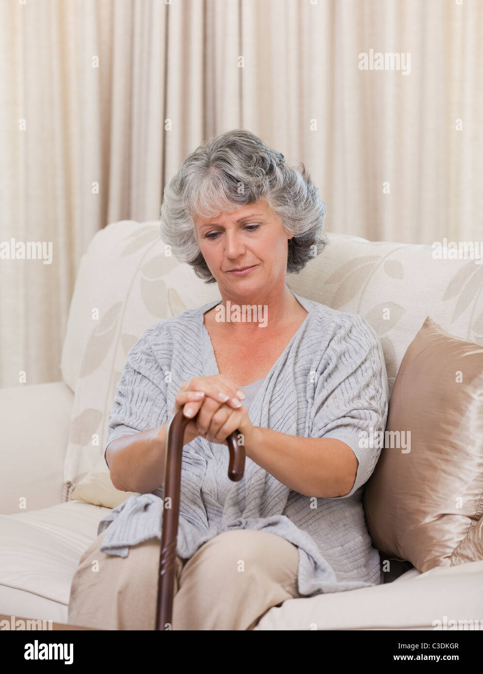 Woman with her walking stick Stock Photo - Alamy