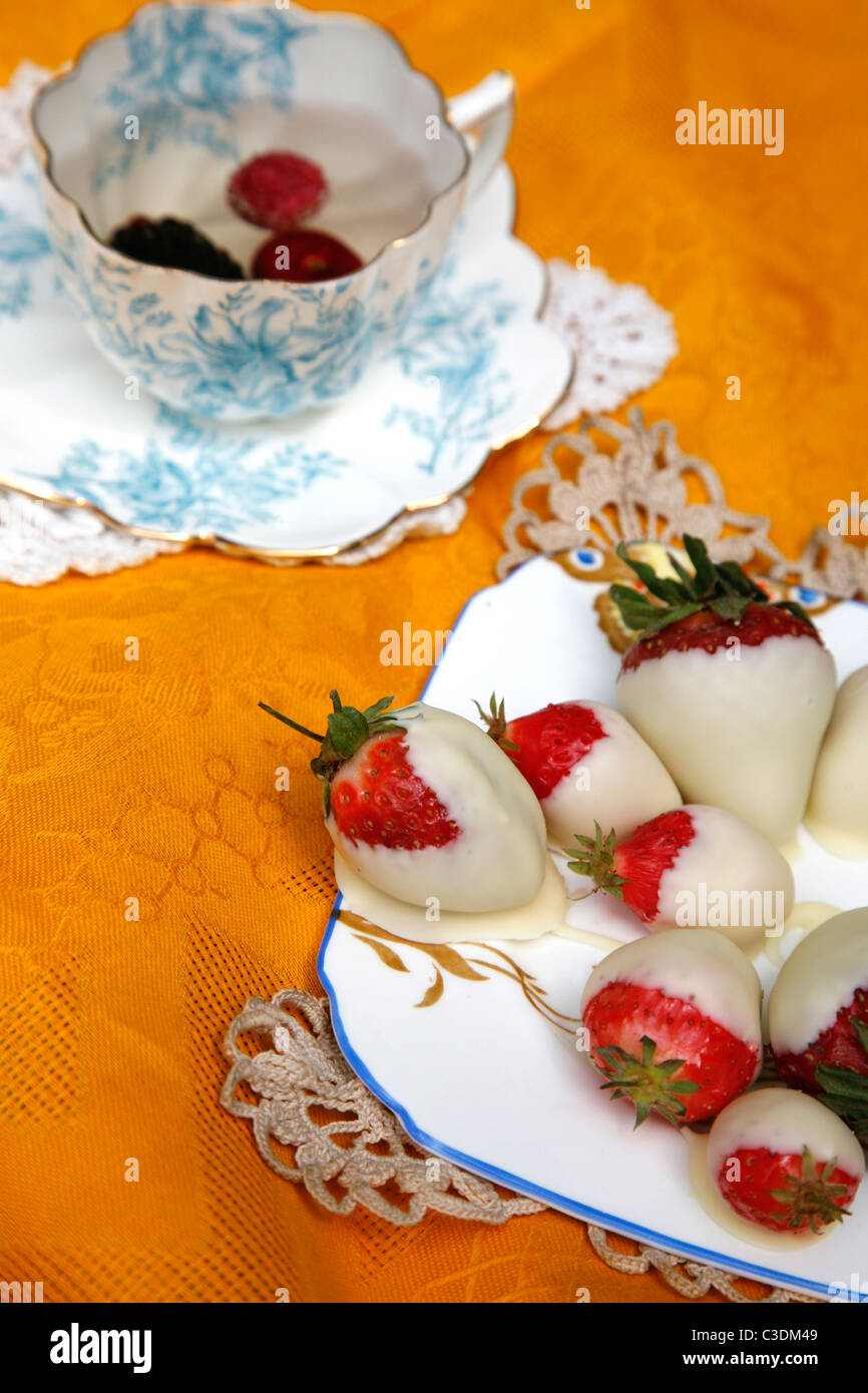 Traditional English cream tea picnic served on vintage crockery Stock Photo