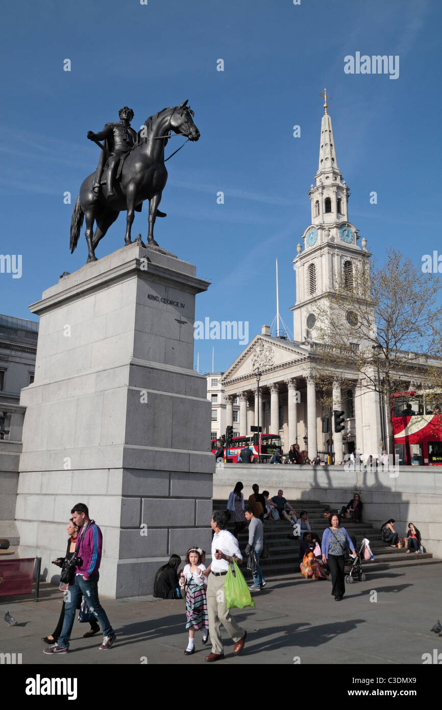 Statue of King George IV on horseback with the spire of St Martin in the Field behind, in Trafalgar Square, London, UK. Stock Photo