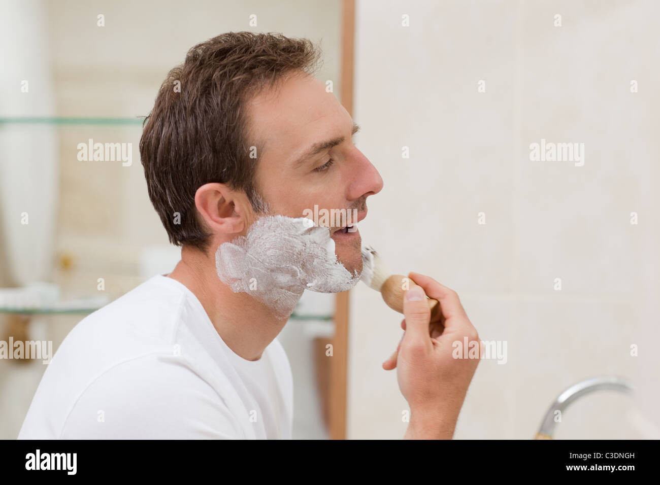 Man shaving in the bathroom Stock Photo Alamy