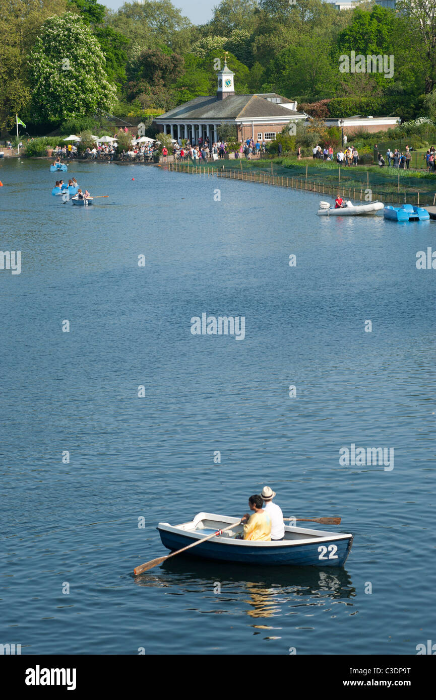 Pleasure boats on the Serpentine in Hyde Park, near the Lido cafe bar in London, England UK. Stock Photo