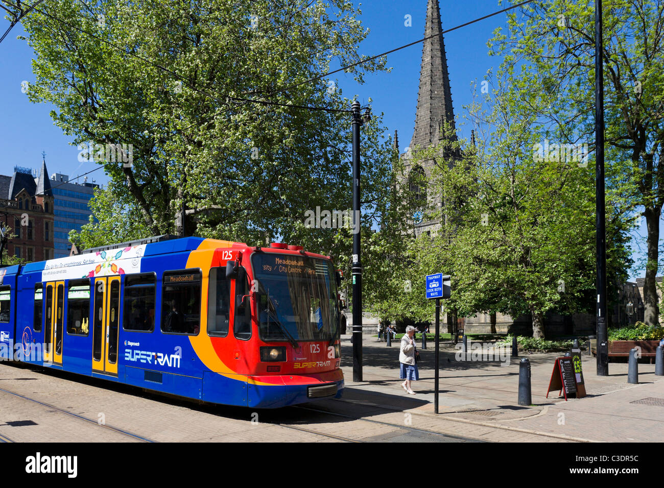 Supertram in front of the Cathedral (Cathedral Church of St Peter and St Paul), Sheffield, South Yorkshire, UK Stock Photo
