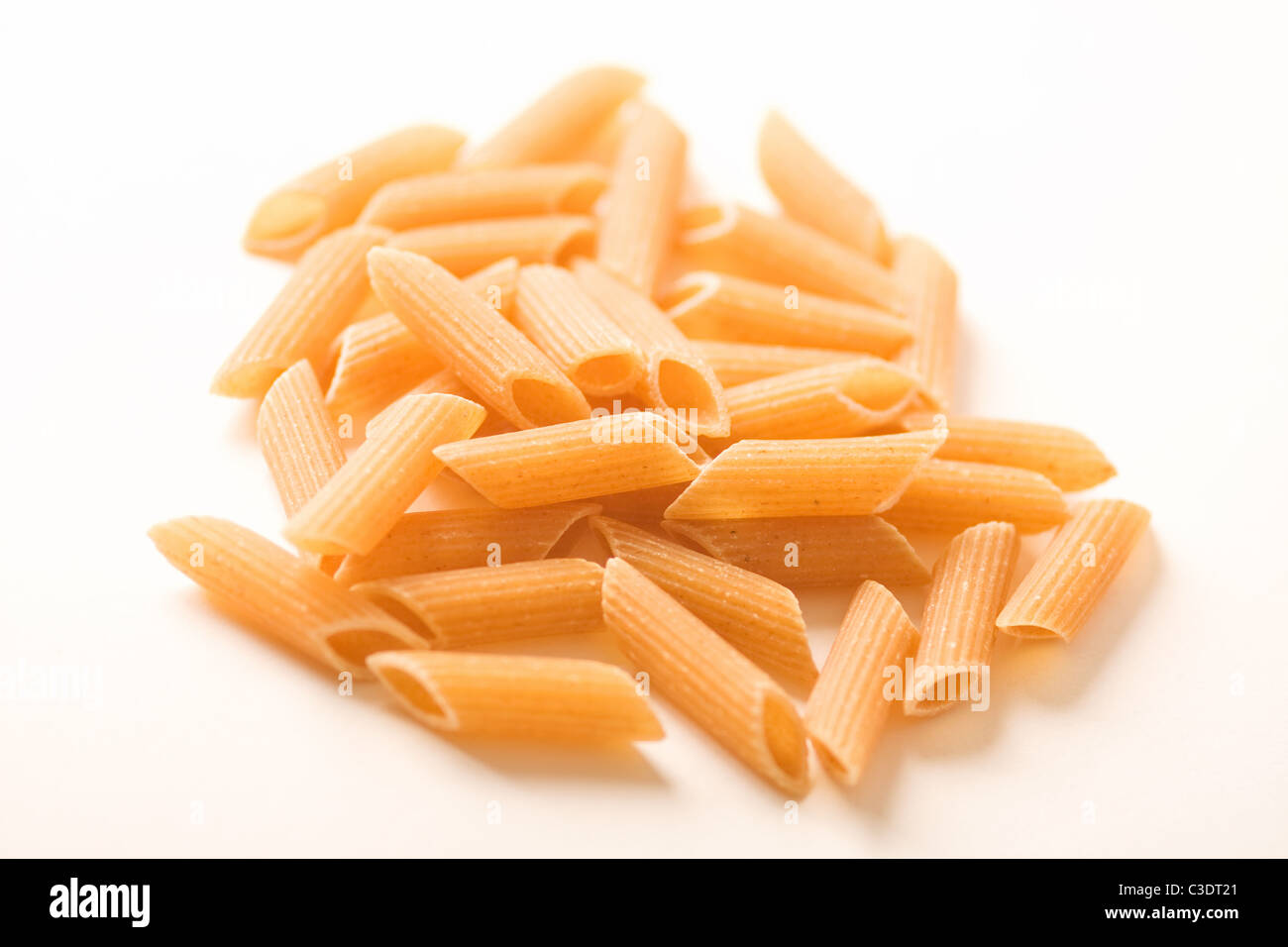 Dried Whole Wheat Penne Pasta Stock Photo