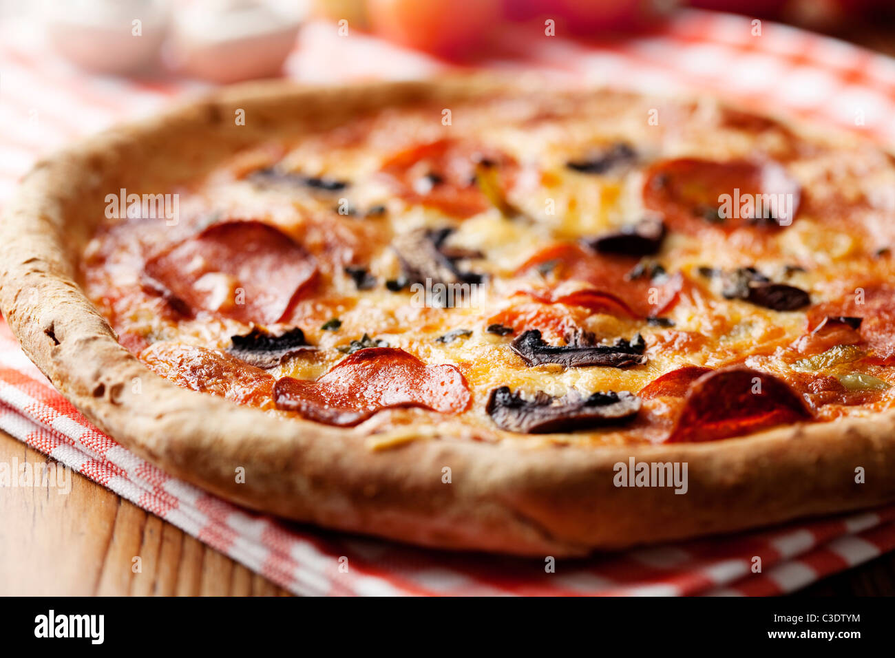 pepperoni and mushrooom pizza closeup, shallow dof Stock Photo